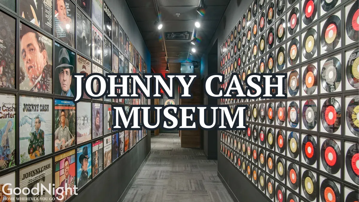 This is an interior view of the Johnny Cash Museum, featuring framed album covers, decorative vinyl records, and clear museum signage. People are seen exploring exhibits and learning about musical history.